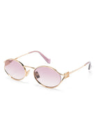 Miu Miu MU52YS 5AK06S oval fraame gold sunglasses with logo details - Chris Optics